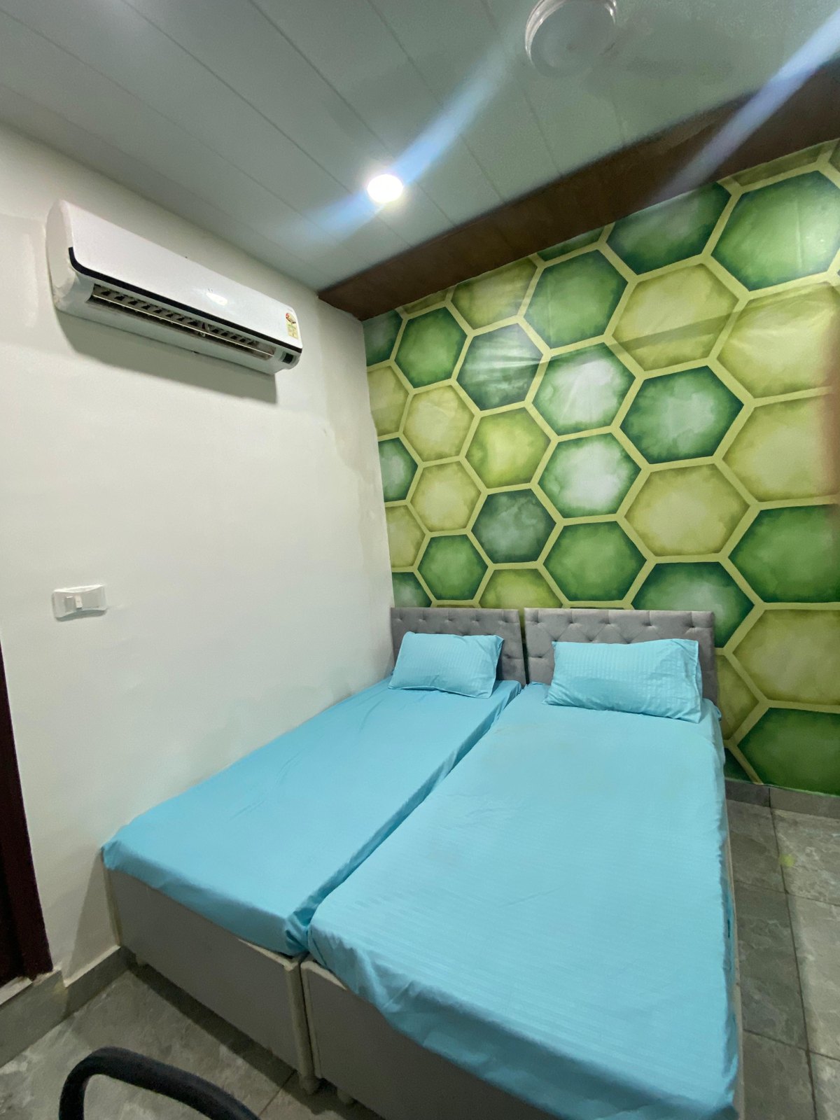 Double sharing AC room with feature wall